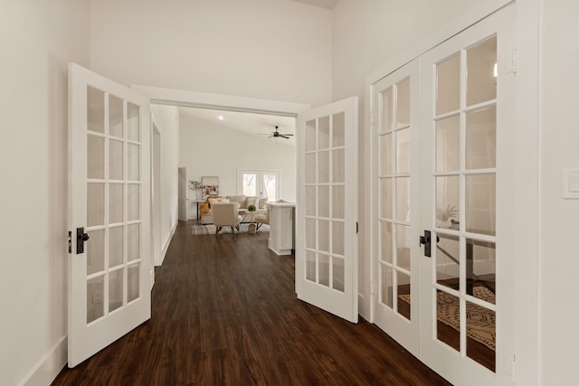 corridor featuring french doors and dark wood finished floors