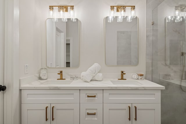 bathroom featuring double vanity, a shower, and a sink