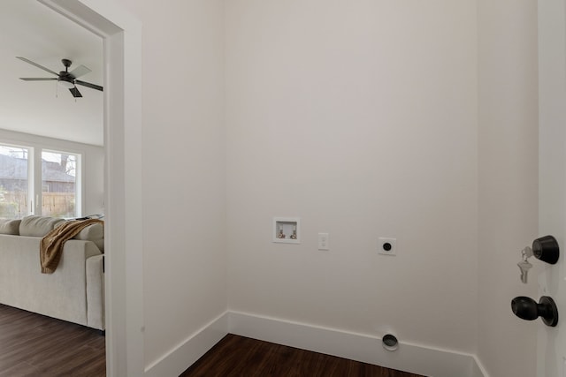 laundry room with electric dryer hookup, washer hookup, baseboards, and dark wood-style flooring