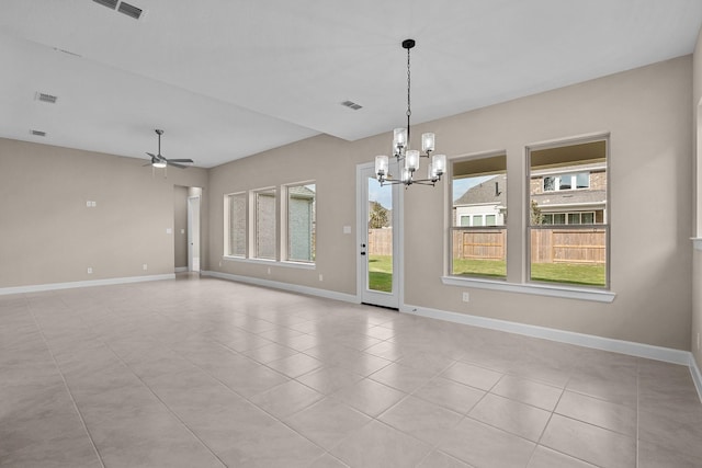 empty room with light tile patterned flooring, visible vents, ceiling fan with notable chandelier, and baseboards