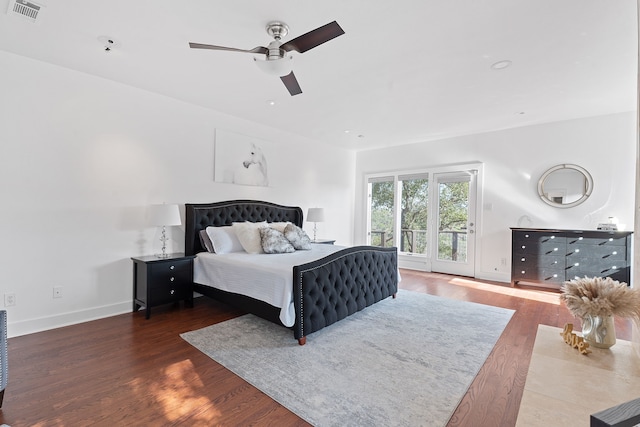 bedroom with visible vents, a ceiling fan, access to outside, wood finished floors, and baseboards