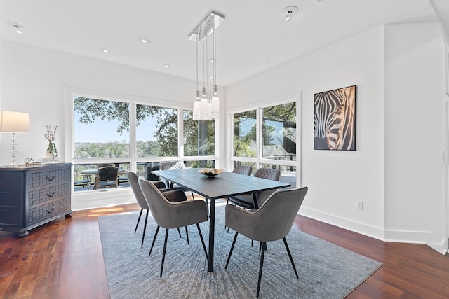 dining room featuring dark wood-type flooring, recessed lighting, and baseboards