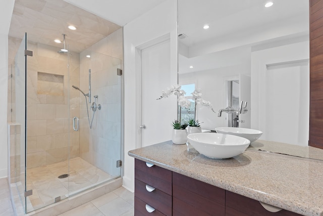 full bath with vanity, visible vents, recessed lighting, tile patterned flooring, and a shower stall