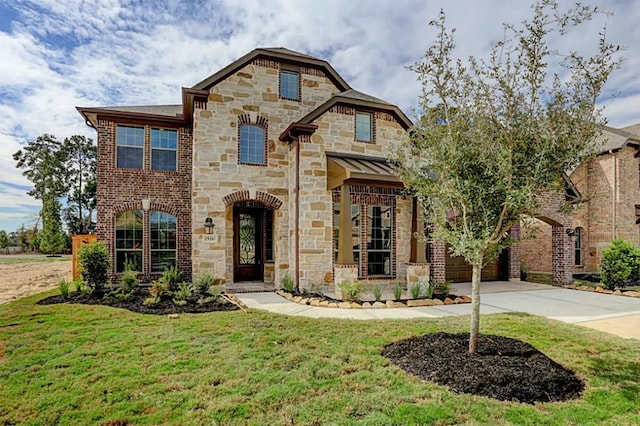 french country inspired facade with a garage, a front lawn, and driveway