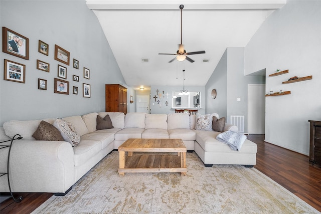 living room featuring a ceiling fan, wood finished floors, visible vents, and high vaulted ceiling