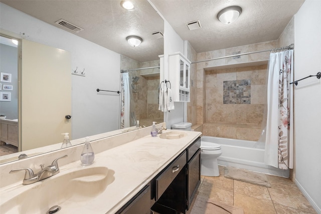 full bathroom with visible vents, toilet, a sink, a textured ceiling, and shower / tub combo