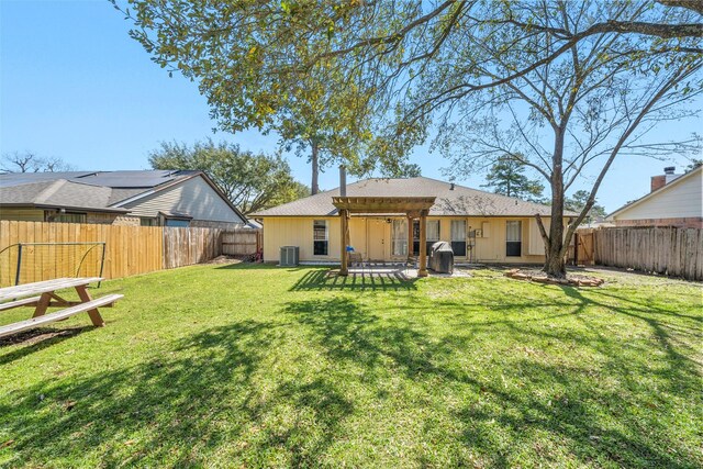 back of house featuring central air condition unit, a lawn, a pergola, a patio, and a fenced backyard