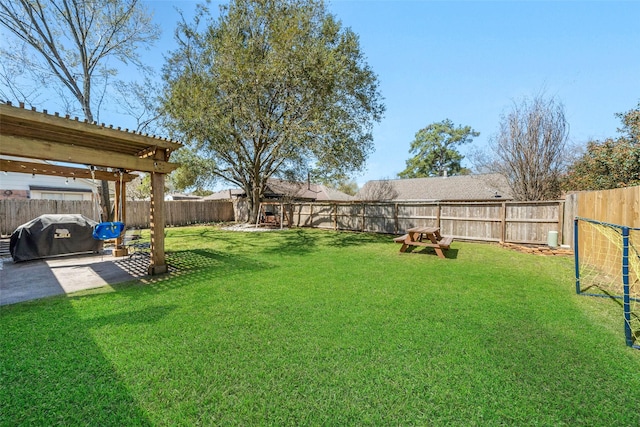 view of yard featuring a patio area and a fenced backyard