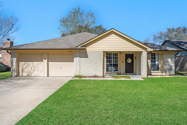 single story home featuring brick siding, a shingled roof, a front lawn, concrete driveway, and an attached garage