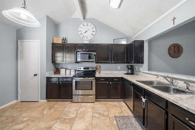 kitchen with a sink, decorative light fixtures, dark brown cabinetry, appliances with stainless steel finishes, and lofted ceiling