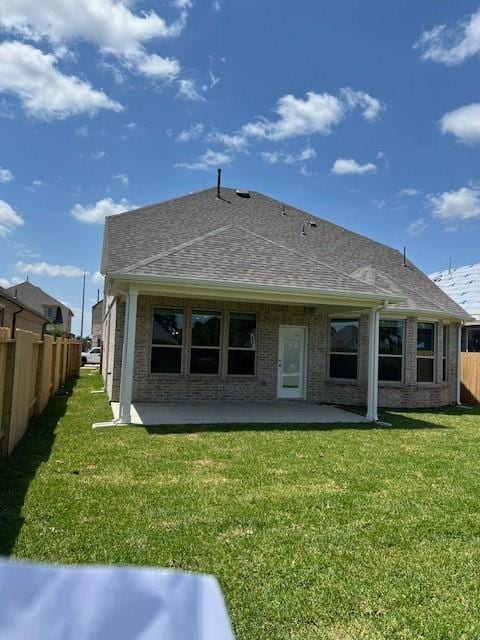 26711 Grandiflora Dr, Magnolia, TX 77355 - rear view of property with a patio area, roof with shingles, and brick siding