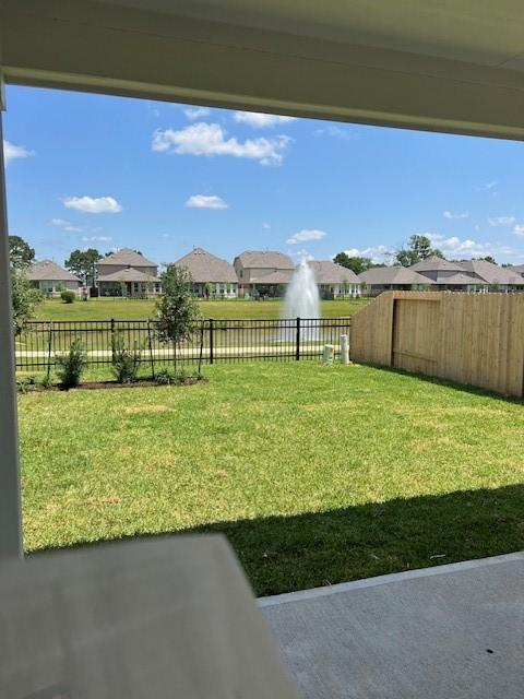 26711 Grandiflora Dr, Magnolia, TX 77355 - view of yard with a residential view and a patio area