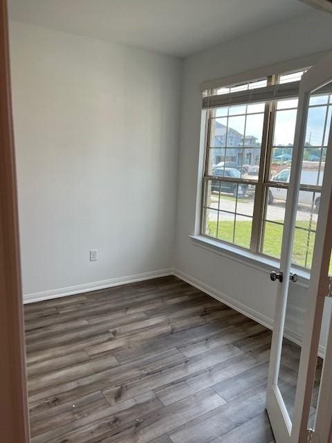 26711 Grandiflora Dr, Magnolia, TX 77355 - spare room featuring wood finished floors, baseboards, and french doors