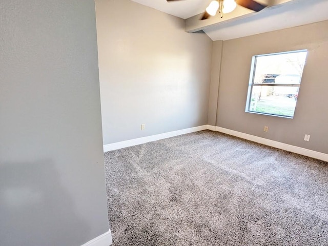 carpeted empty room with beamed ceiling, baseboards, and ceiling fan