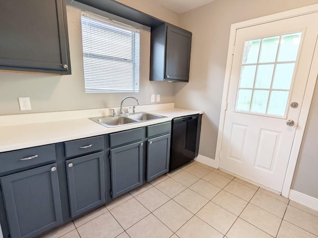 kitchen featuring a sink, black dishwasher, a healthy amount of sunlight, and light countertops