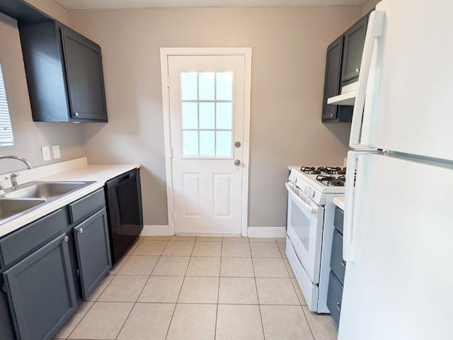 kitchen with white appliances, light tile patterned floors, a sink, light countertops, and under cabinet range hood