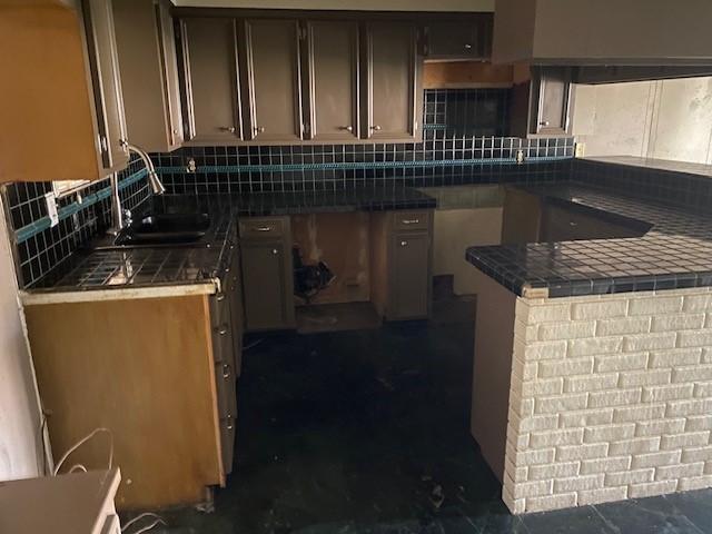 kitchen with backsplash and a sink