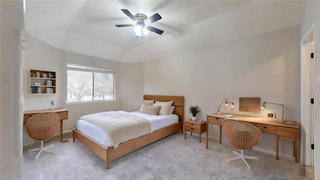 carpeted bedroom with a ceiling fan and baseboards