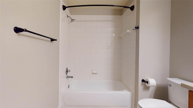 bathroom featuring toilet and shower / tub combination