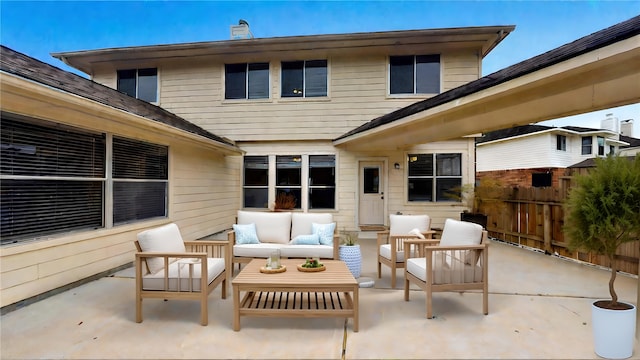 view of patio with outdoor lounge area and fence