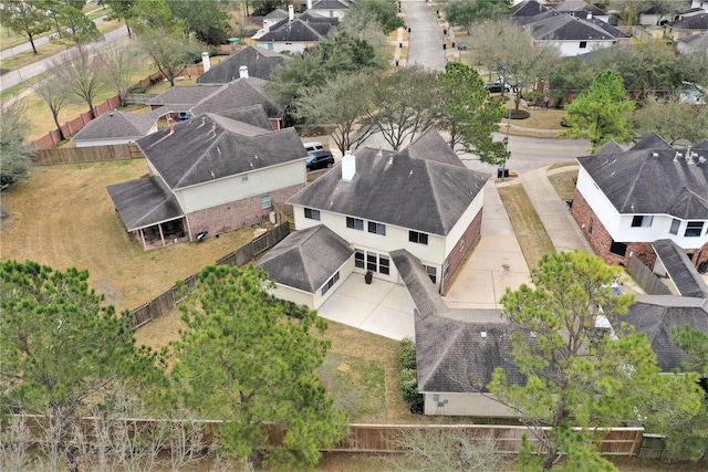 birds eye view of property with a residential view