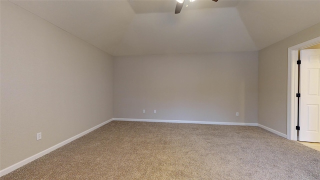 additional living space featuring ceiling fan, lofted ceiling, baseboards, and light carpet