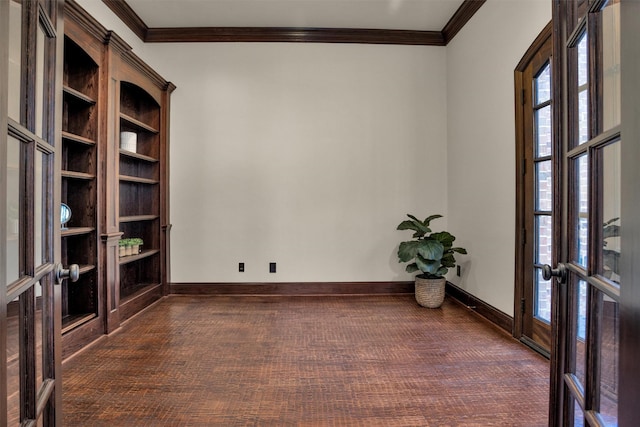 empty room with french doors, crown molding, baseboards, and dark wood-style flooring