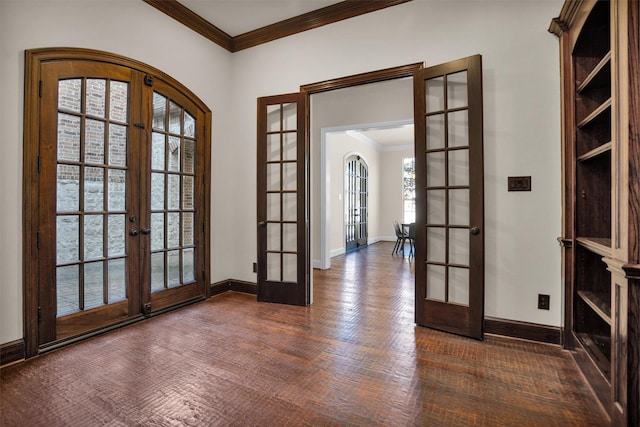 foyer with french doors, baseboards, and ornamental molding