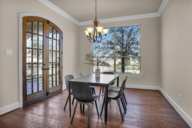 dining area featuring french doors, baseboards, and ornamental molding