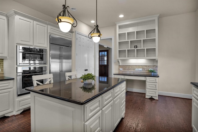 kitchen featuring open shelves, tasteful backsplash, dark countertops, stainless steel appliances, and white cabinets