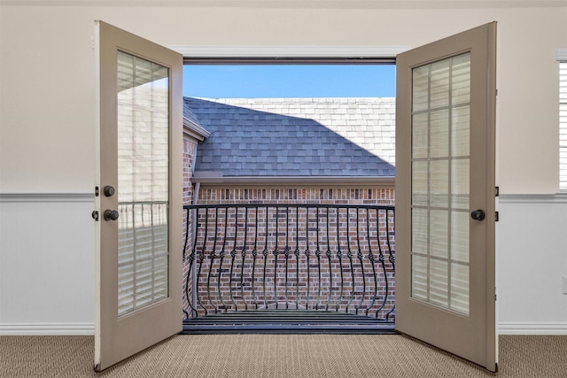 doorway with carpet floors