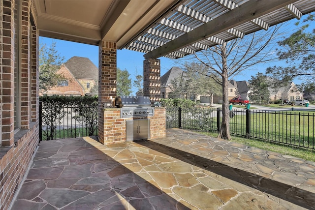 view of patio with grilling area, a pergola, exterior kitchen, and fence