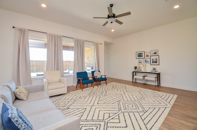 sitting room featuring recessed lighting, wood finished floors, baseboards, and ceiling fan