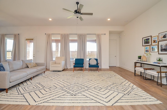 living room featuring recessed lighting, a healthy amount of sunlight, ceiling fan, and wood finished floors