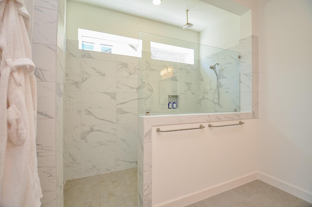 bathroom featuring baseboards and walk in shower