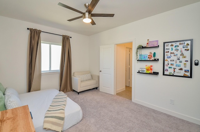 bedroom featuring baseboards, ceiling fan, and carpet flooring