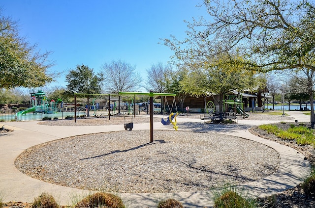 communal playground featuring fence