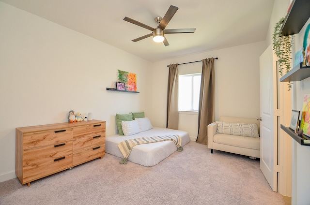 bedroom with light carpet and ceiling fan