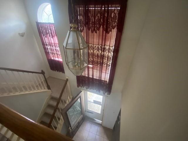 entryway featuring tile patterned floors and stairs