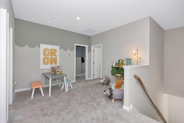 playroom featuring baseboards and carpet floors