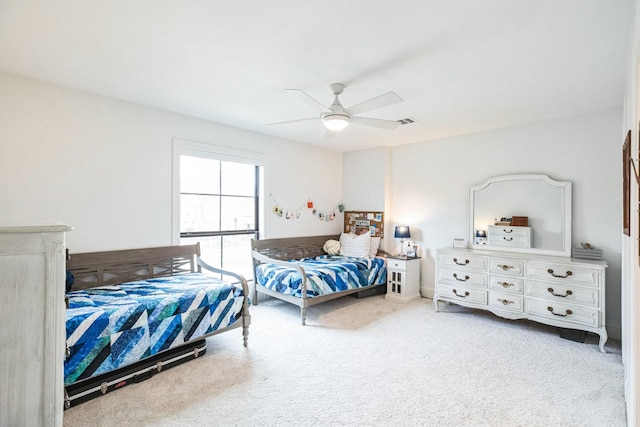 bedroom with visible vents, ceiling fan, and carpet floors