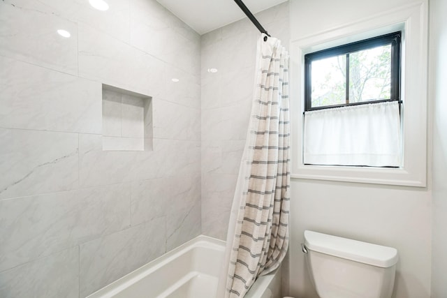 full bath with shower / bath combination with curtain and toilet