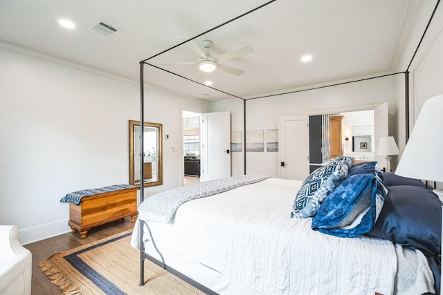 bedroom featuring visible vents, recessed lighting, crown molding, and wood finished floors