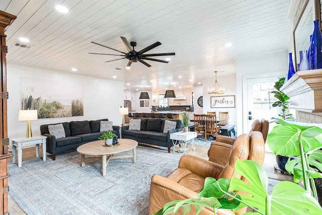 living area featuring visible vents, recessed lighting, crown molding, wooden ceiling, and ceiling fan with notable chandelier