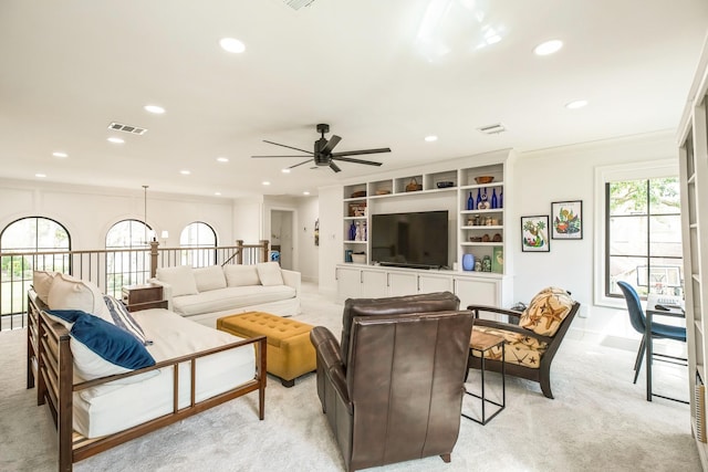 living room featuring light carpet, visible vents, and recessed lighting