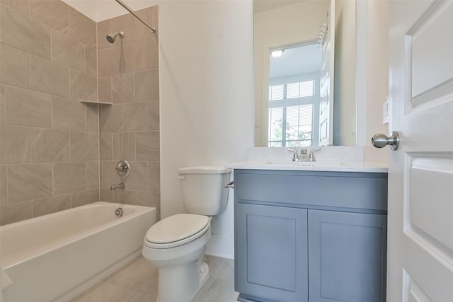 bathroom with tile patterned flooring, toilet, vanity, and bathtub / shower combination