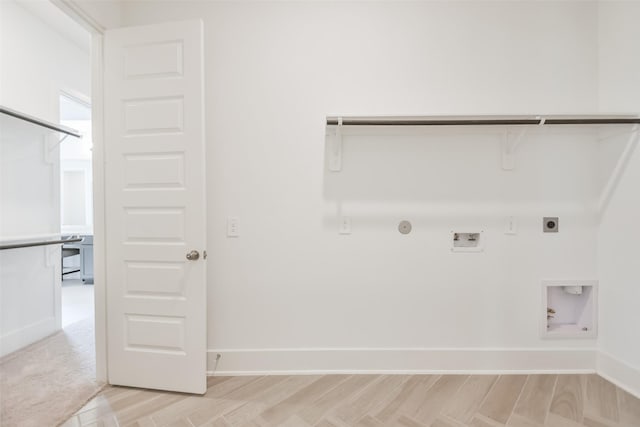 washroom featuring baseboards, laundry area, hookup for a washing machine, light wood-style flooring, and electric dryer hookup