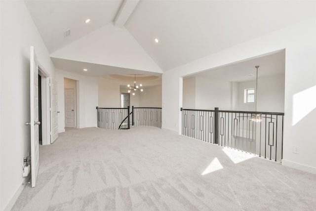 empty room featuring a notable chandelier, beamed ceiling, high vaulted ceiling, and carpet flooring