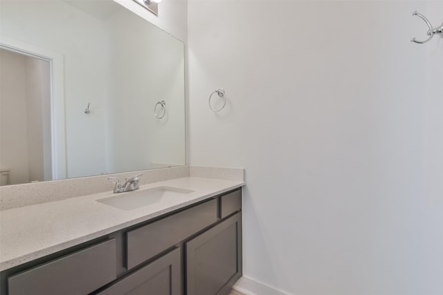 bathroom featuring vanity and baseboards