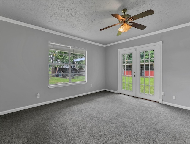 carpeted spare room featuring a textured ceiling, plenty of natural light, french doors, and ornamental molding